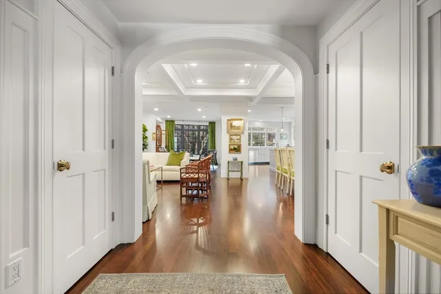 wooden floor with a dining table and chairs in a room