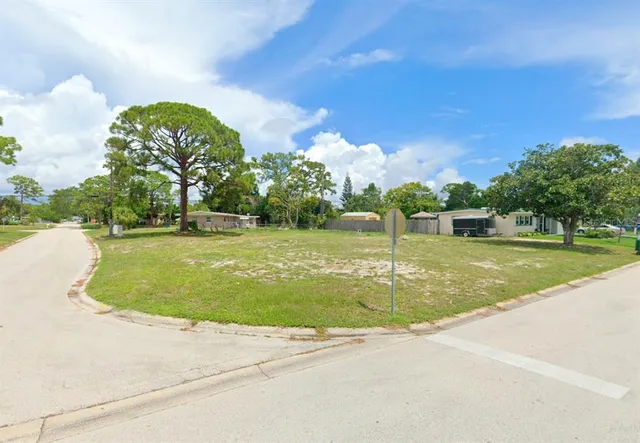 a view of a playground with basketball court