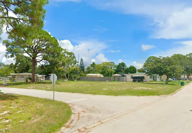 a view of a swimming pool and a yard