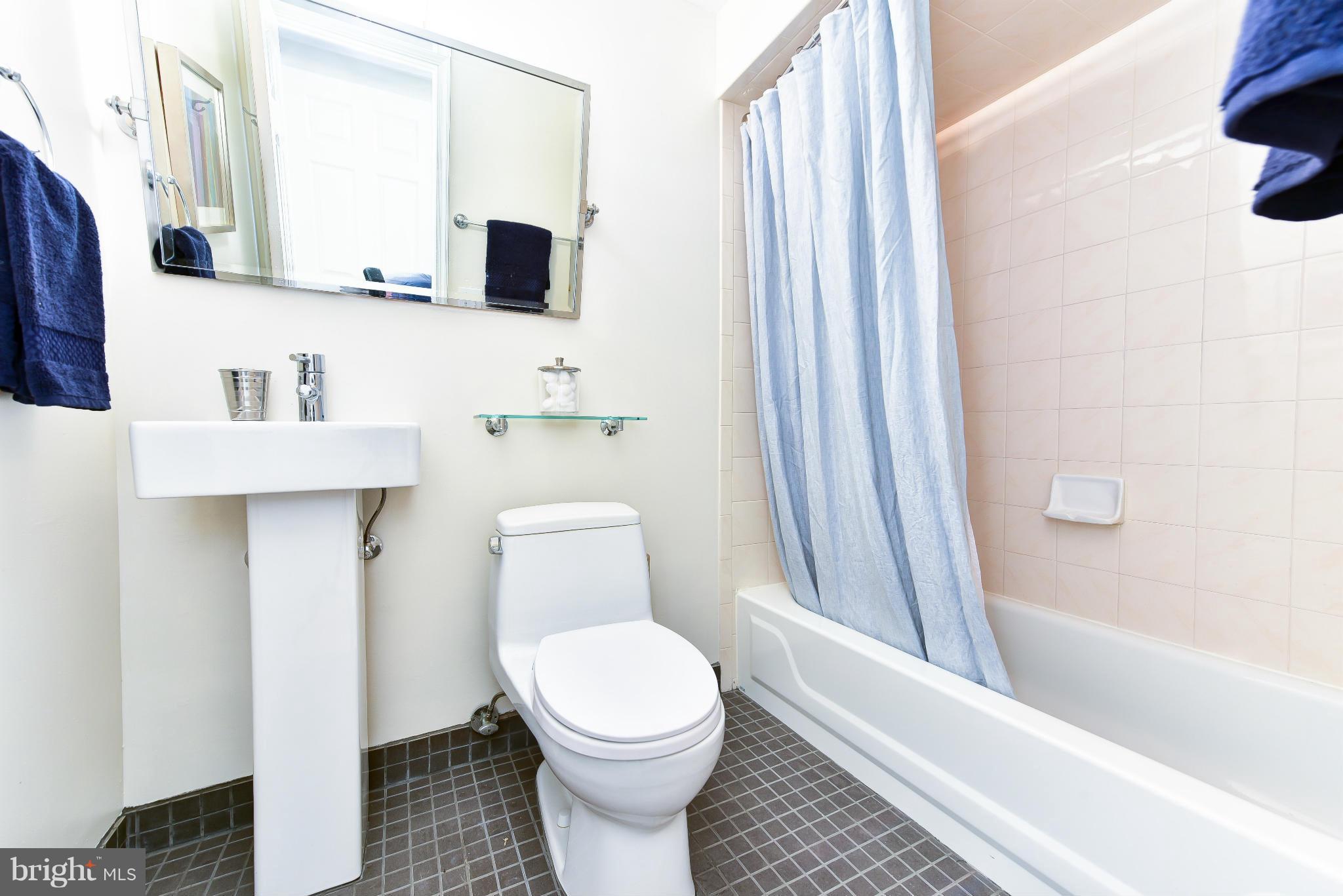 1749 Seaton Street Northwest Washington, DC 20009 - Photo 15 of 22 a bathroom with a toilet a sink and a bathtub