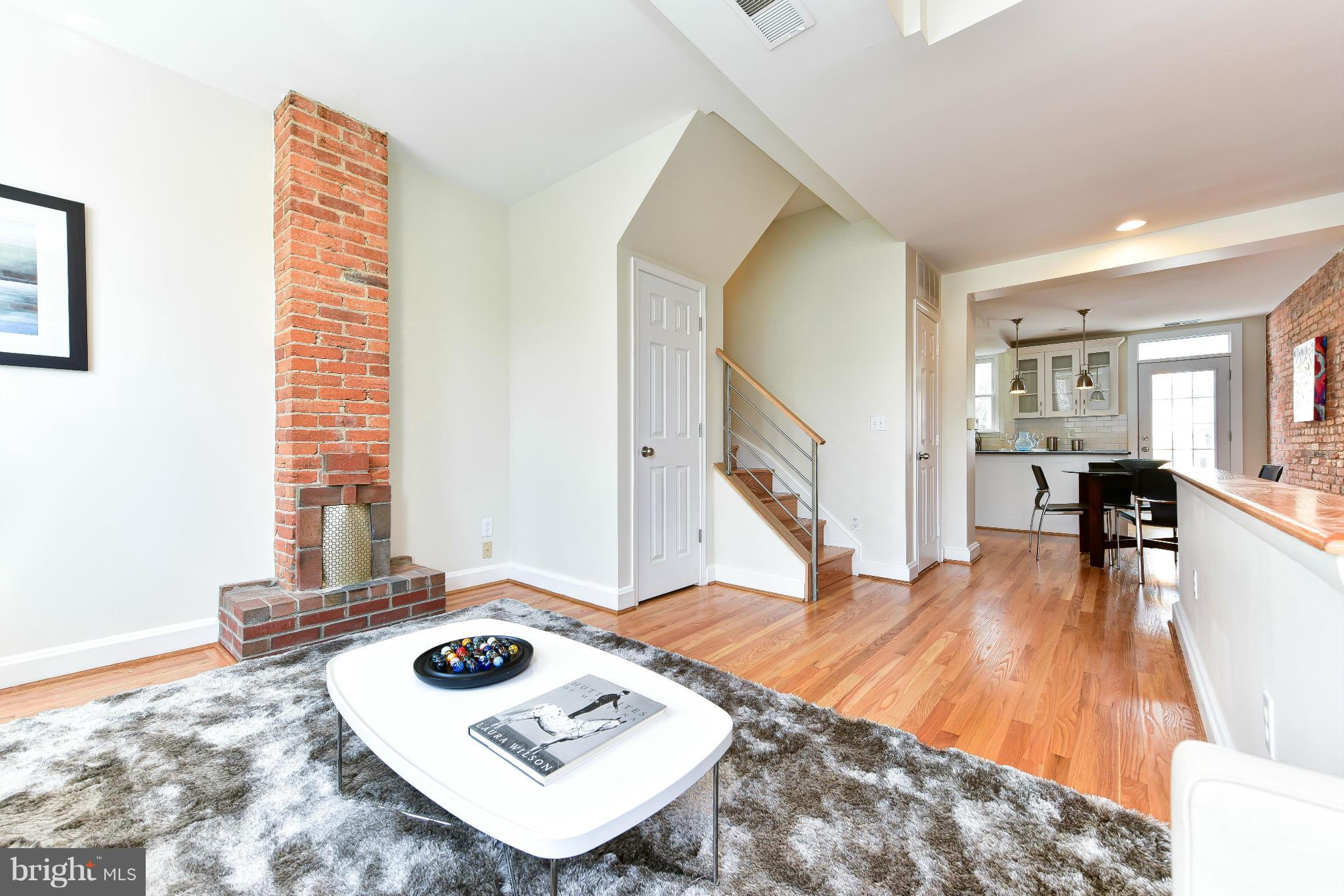 1749 Seaton Street Northwest Washington, DC 20009 - Photo 17 of 22 a living room with furniture and a wooden floor