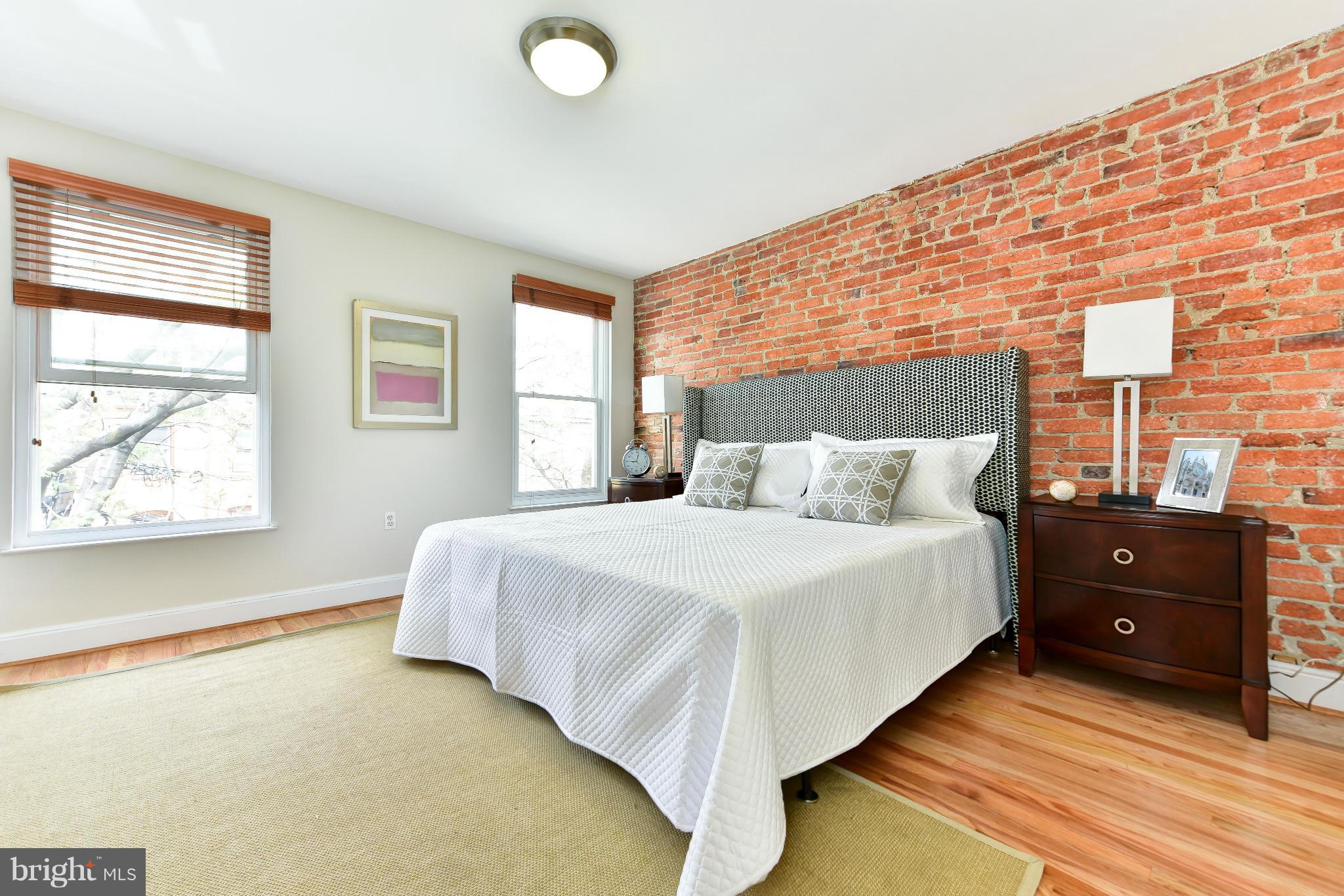 1749 Seaton Street Northwest Washington, DC 20009 - Photo 6 of 22 a bedroom with a bed and window