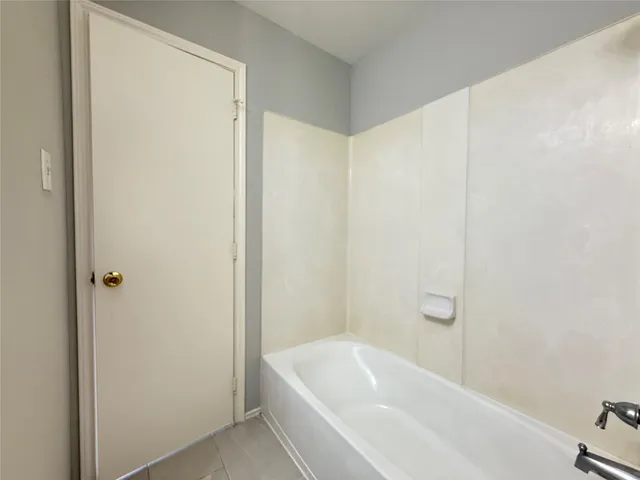 a bathroom with a white bath tub