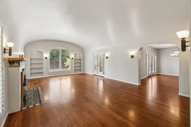 a large kitchen with a table and chairs