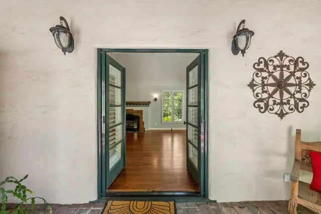 a bathroom with a granite countertop sink double and mirror