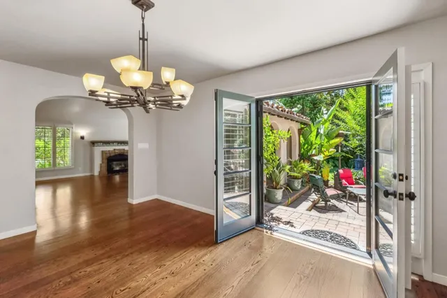 a view of balcony with wooden fence and potted plants