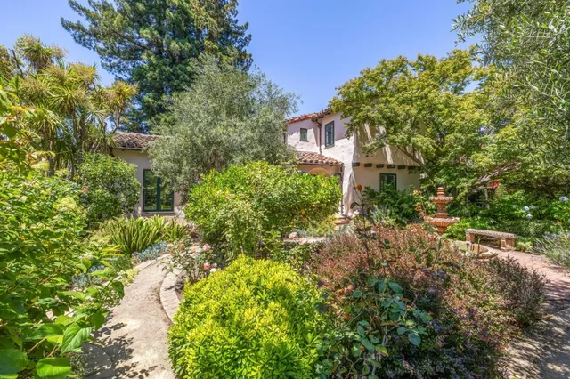 a living room with a fireplace with wooden floor