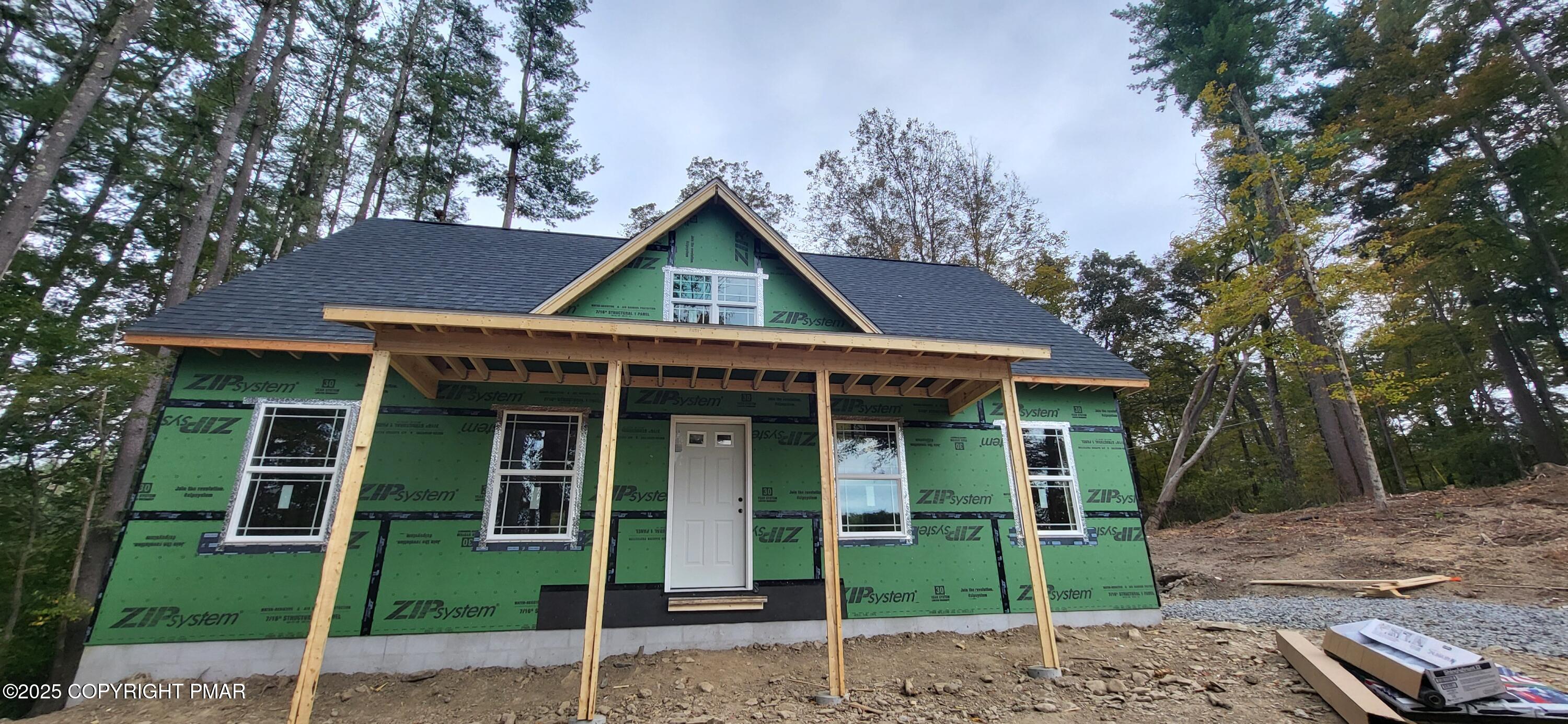 Lot 5 Murray Hill Road East Stroudsburg, PA 18302 - Photo 6 of 15 a front view of a house with a garden