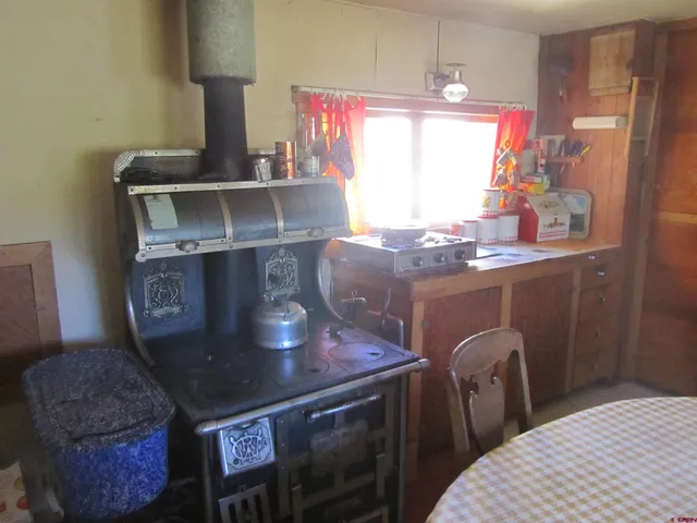 a bedroom with a bed and a table