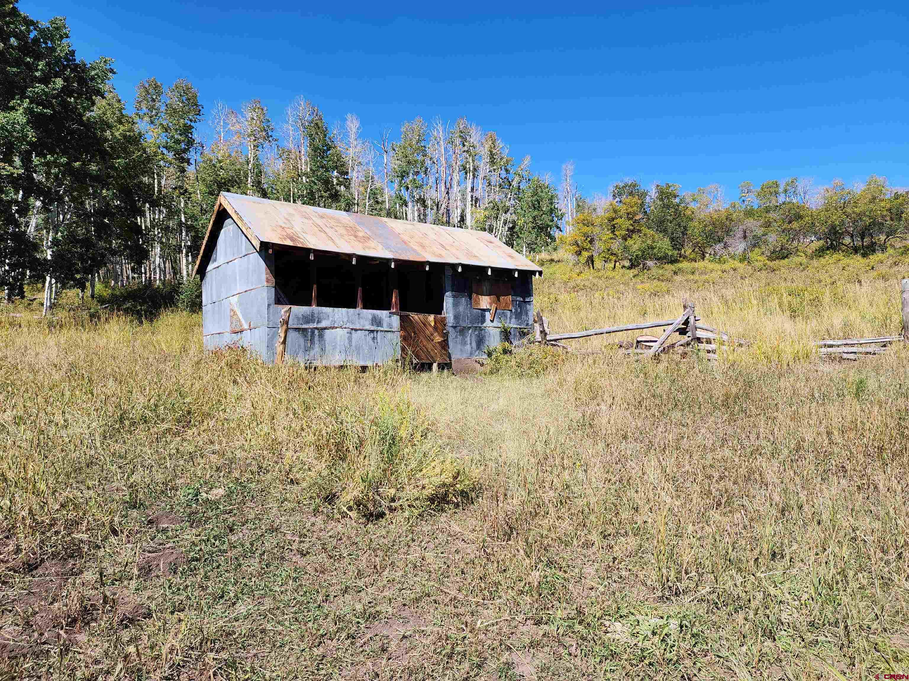 2586 26 1/10 Road Whitewater, CO 81527 - Photo 37 of 45 a view of a lake with a house in the background