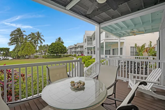 a view of a chairs and table in patio