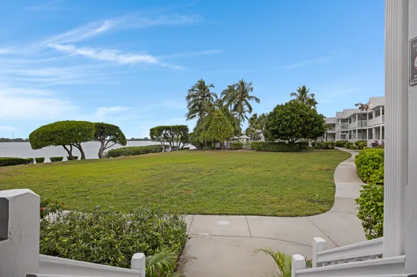 a view of balcony with two chairs and a table