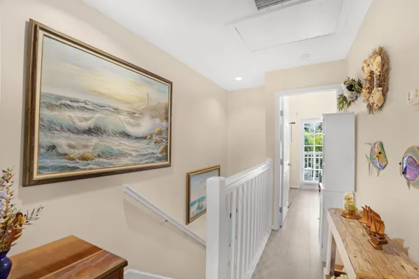 a bathroom with a bathtub a sink and a mirror