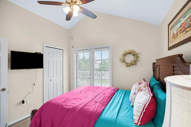 a bedroom with a bed and a view of bedroom