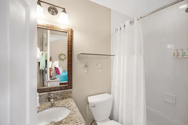 a bed room with a bed and a chandelier