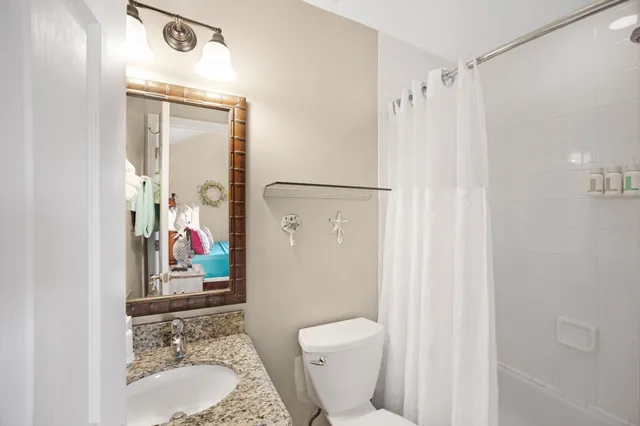 a bed room with a bed and a chandelier