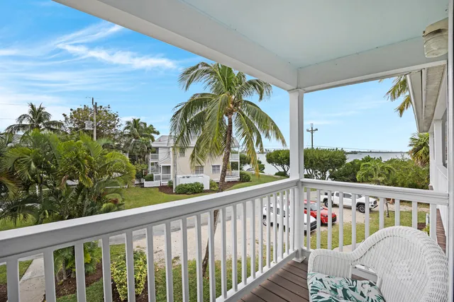 a bathroom with a sink a toilet and shower curtain