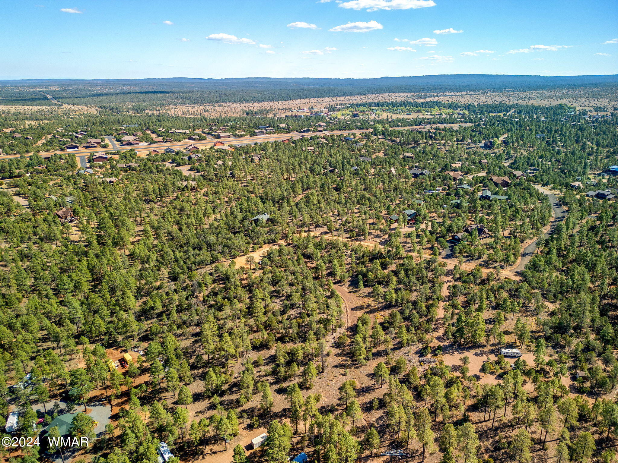 2306 Thunderbird Way Overgaard, AZ 85933 - Photo 10 of 22 an aerial view of residential houses with outdoor space and trees