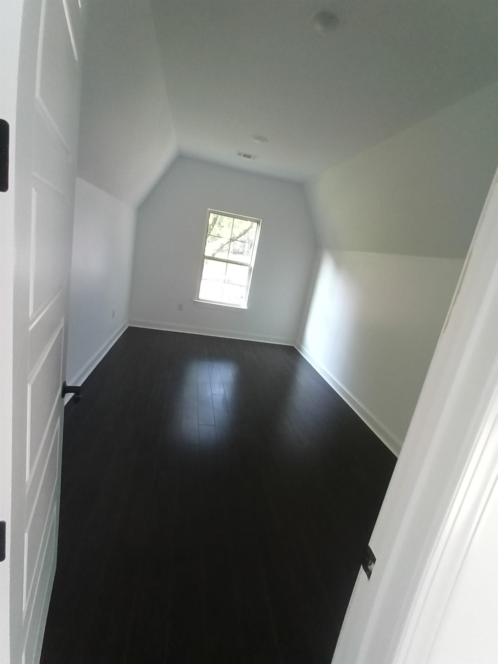 5690 Walnut Grove Road Memphis, TN 38120 - Photo 10 of 40 wooden floor in an empty room with a window