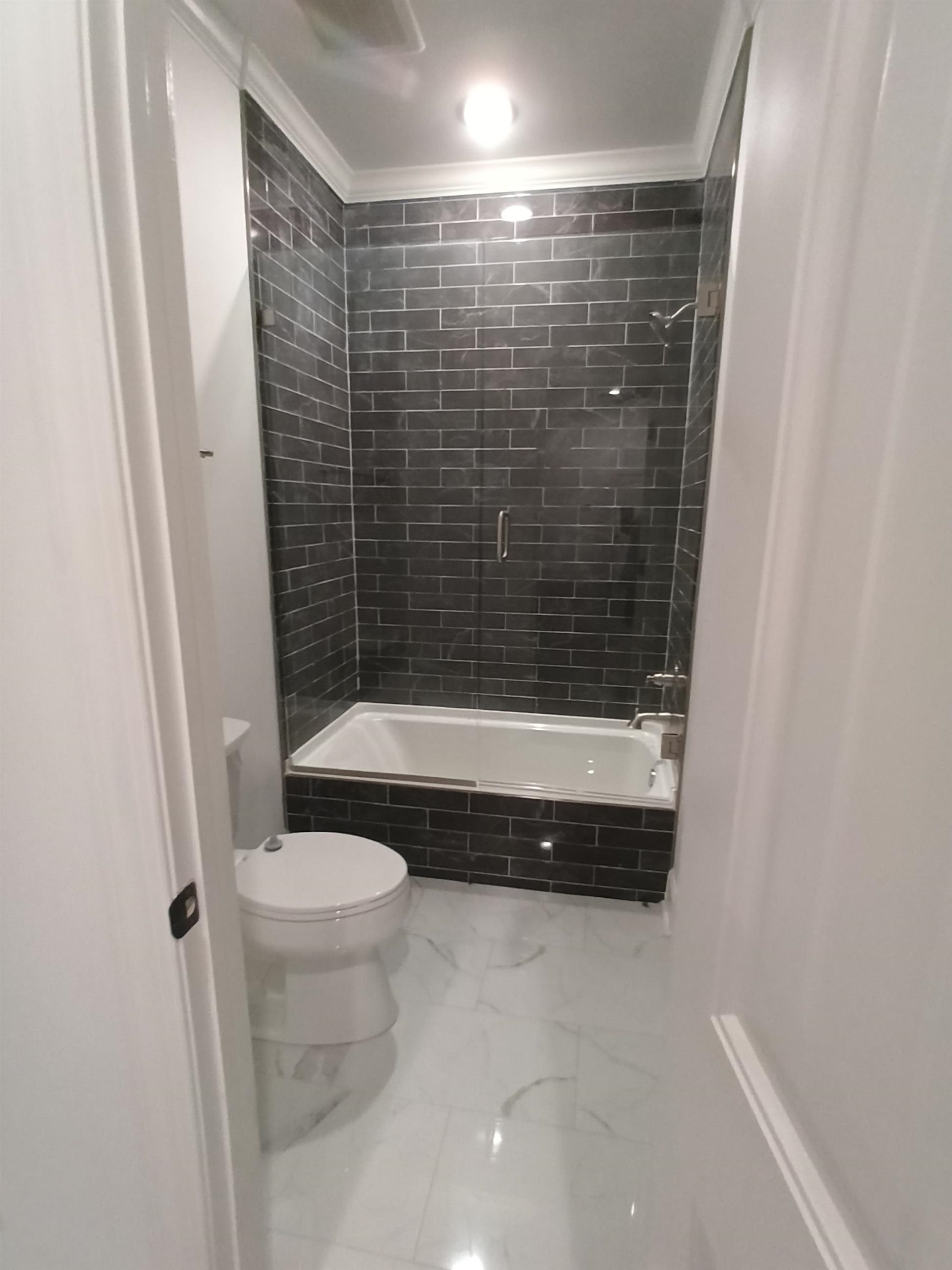 5690 Walnut Grove Road Memphis, TN 38120 - Photo 26 of 40 a bathroom with a shower and a toilet