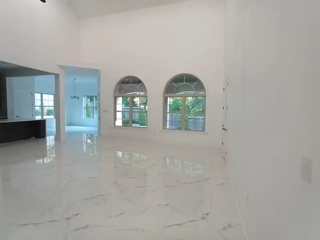 a backyard of a house with plants and trees