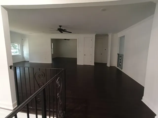 a view of a hallway with stairs