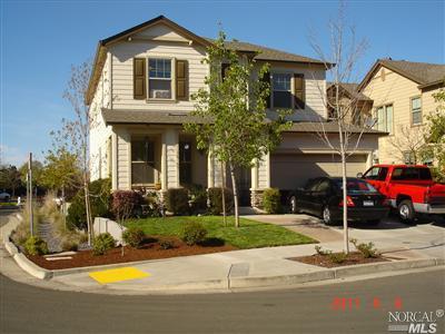 a front view of a house with swimming pool and porch