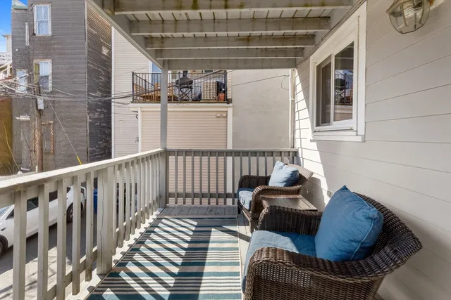 a view of balcony with furniture