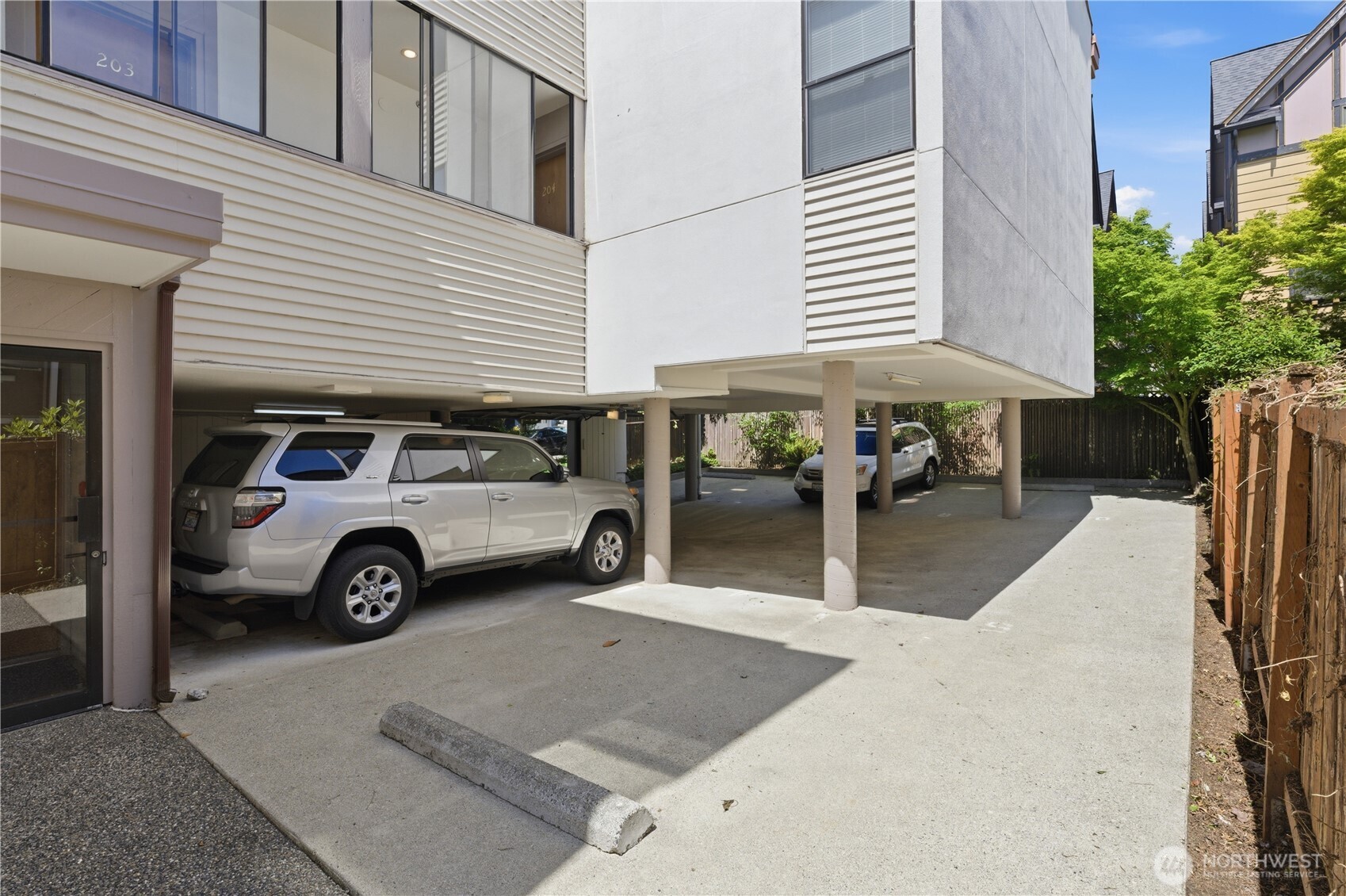 802 North 43rd Street Seattle, WA 98103 - Photo 7 of 18 a view of a cars park in front of house