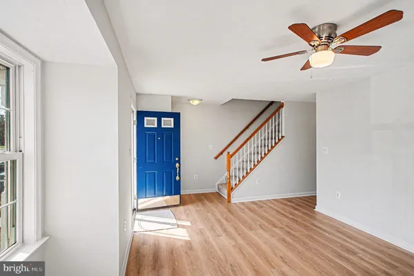 a view of an entryway with wooden floor