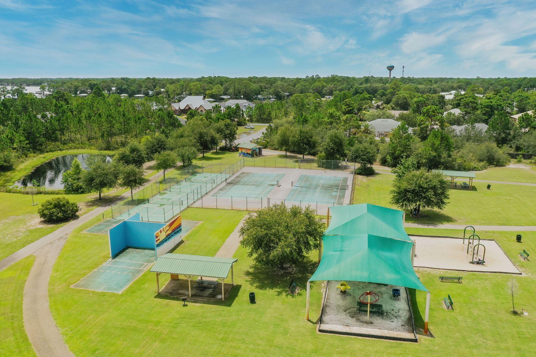 96 Pin Oak Loop Santa Rosa Beach, FL 32459 - Photo 34 of 47 a view of a swimming pool with a yard