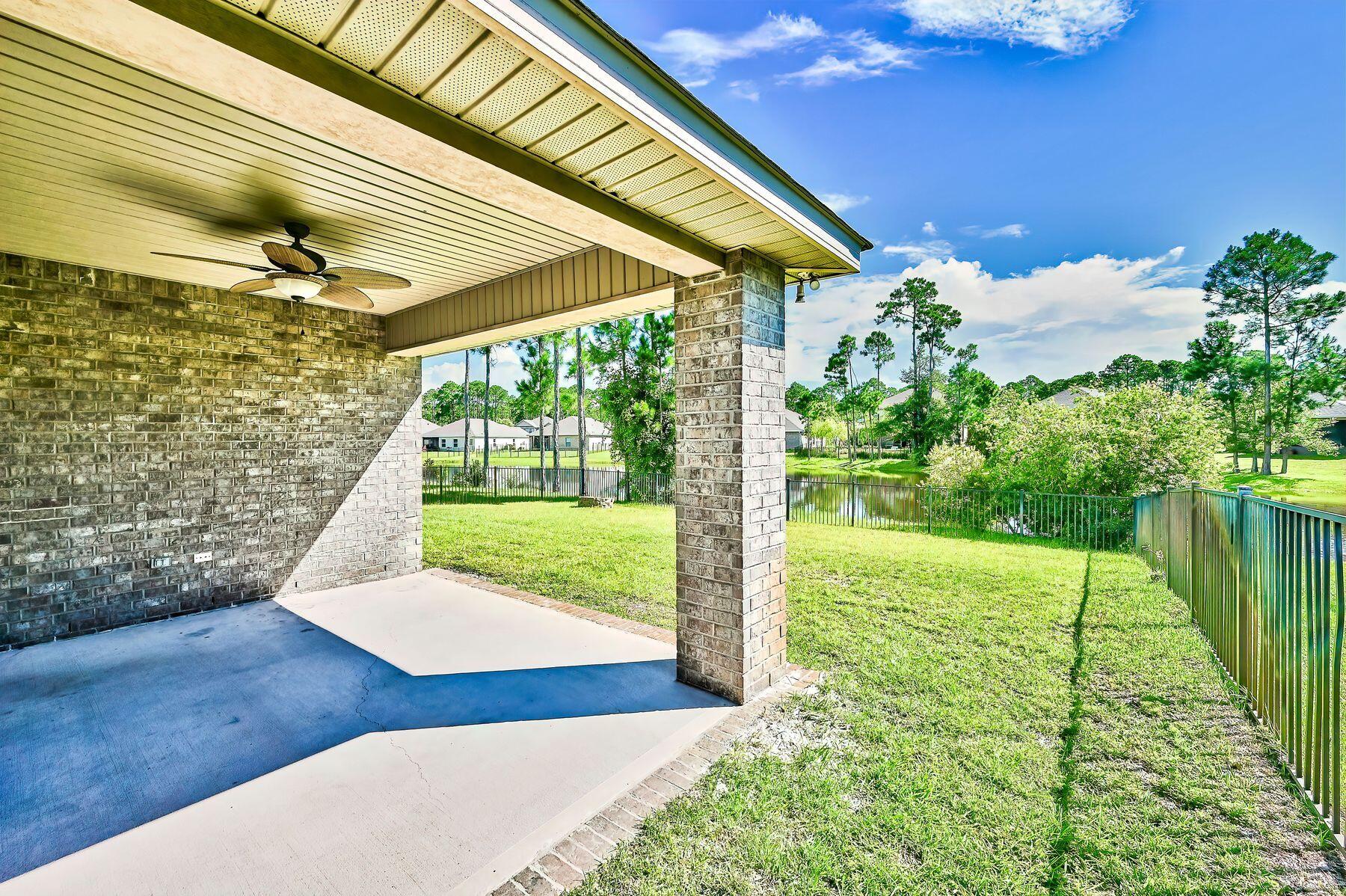 96 Pin Oak Loop Santa Rosa Beach, FL 32459 - Photo 5 of 47 a view of a backyard with garden