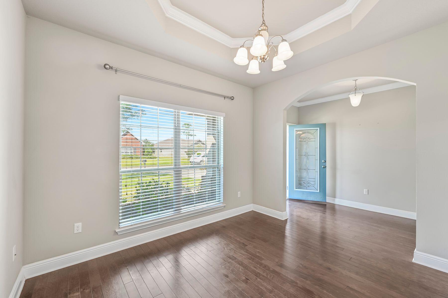 96 Pin Oak Loop Santa Rosa Beach, FL 32459 - Photo 10 of 47 a view of an empty room with wooden floor and a window
