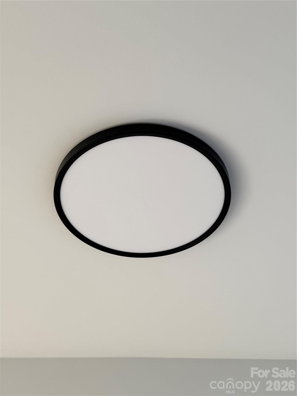 5626 Torrence Street Charlotte, NC 28269 - Photo 25 of 27 a close up of a wall with a mirror