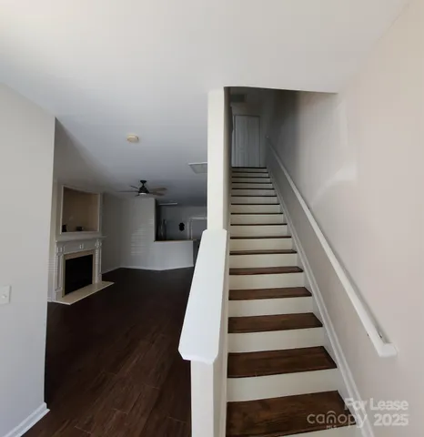 a view of entryway and hall with wooden floor