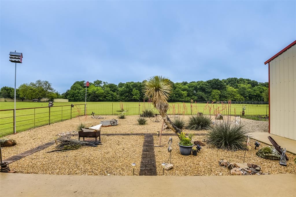 2683 Bells Chapel Road Palmer, TX 75152 - Photo 21 of 30 a view of a garden with plants and furniture