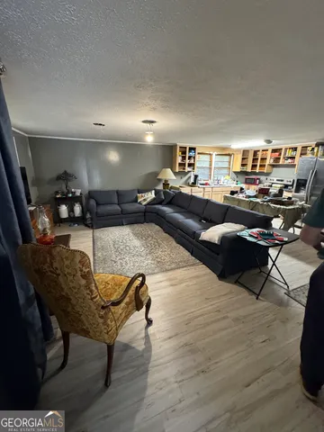 a living room with furniture and a table