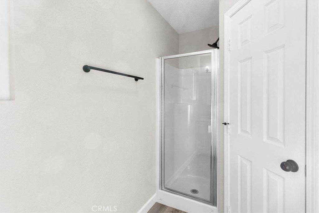 7900 Temecula Place Riverside, CA 92503 - Photo 20 of 22 a bathroom with a glass shower door