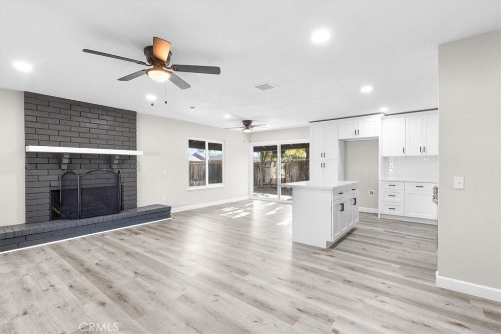 7900 Temecula Place Riverside, CA 92503 - Photo 4 of 22 a view of empty room with wooden floor and window