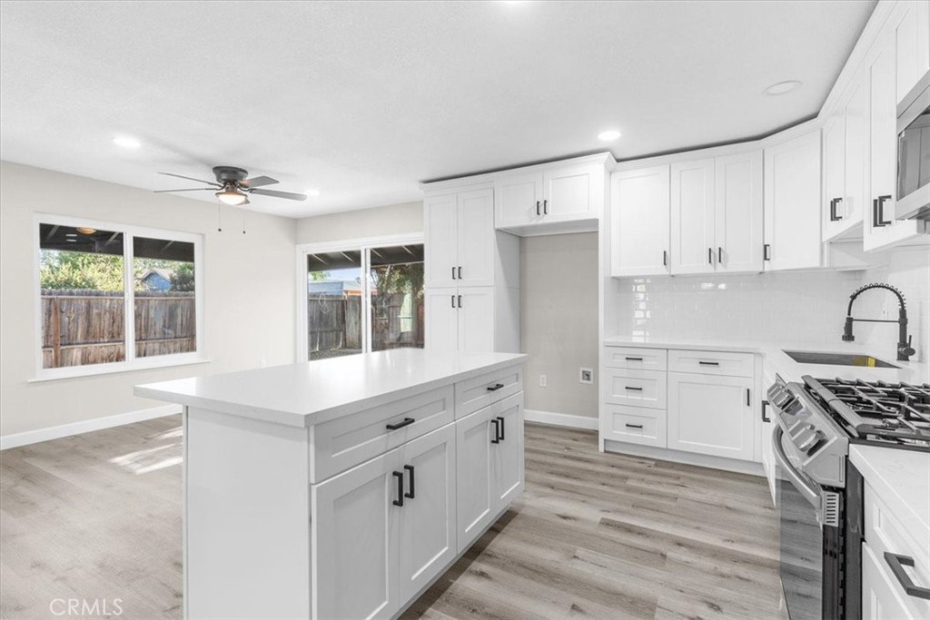 7900 Temecula Place Riverside, CA 92503 - Photo 8 of 22 a kitchen with stainless steel appliances sink cabinets and window