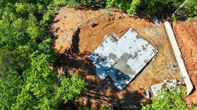 an aerial view of house with yard