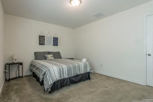 a kitchen with a table and chairs in it