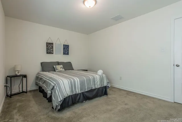 a kitchen with a table and chairs in it