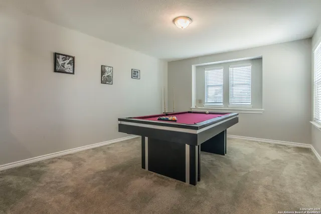 a bedroom with a bed and a tv