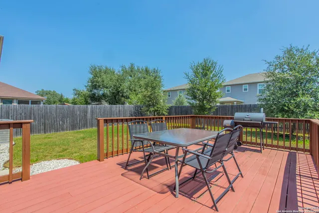 a view of backyard with deck and deck