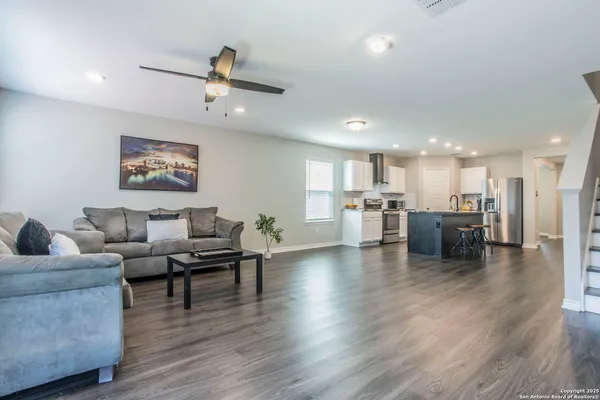a kitchen with a refrigerator and a microwave