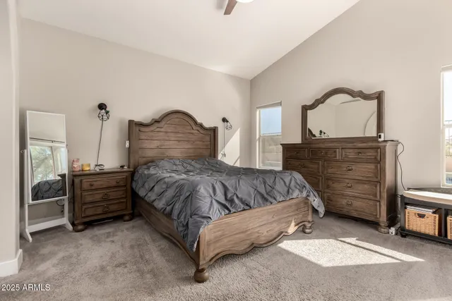 a bedroom with a bed and a dresser