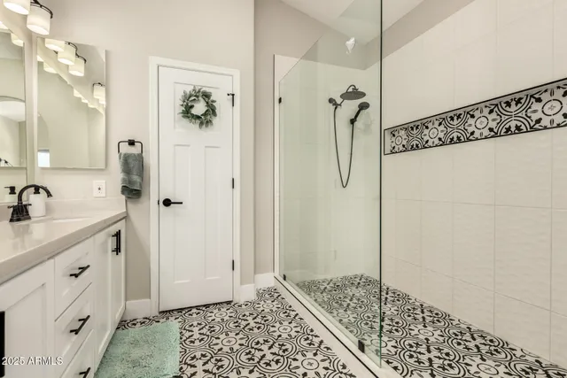 a en suite bathroom with a sink and a mirror