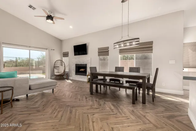 a view of a dining room with furniture window and wooden floor