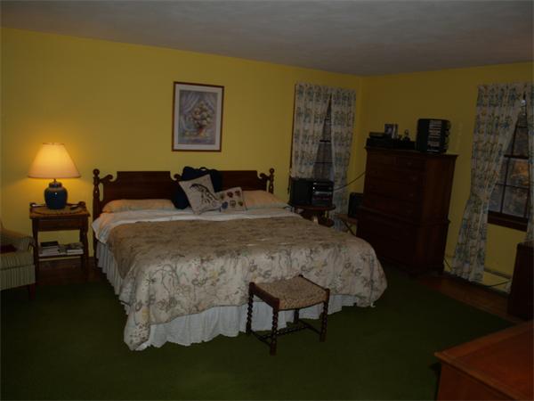 6 Pomfret Road Chelmsford, MA 01824 - Photo 13 of 14 a bed sitting in a bedroom next to a window and a lamp